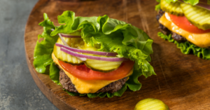 Lettuce wrap burger with fresh ingredients, representing gluten-free food options.