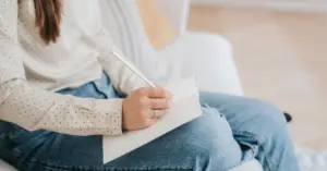 An open journal with a pen resting on it, symbolizing reflection, self-awareness, and actionable steps toward healing from toxic relationships.